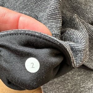 Lululemon pinstriped gray leggings. Not full length but not capri.